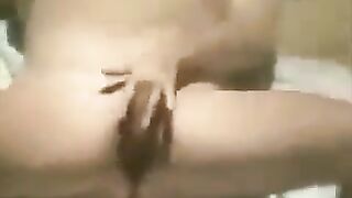 A girl masturbates on the beach, her actions secretly filmed