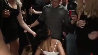 A mature woman is having fun with several guys at the same time