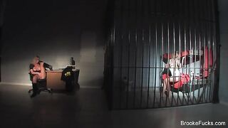 The guard caresses herself with her hands in the uniform