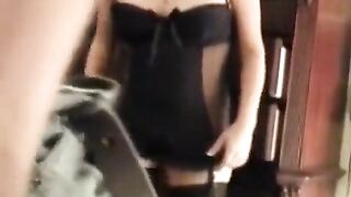 A sexy wife in a corset is pleasuring her husband in this hot homemade scene