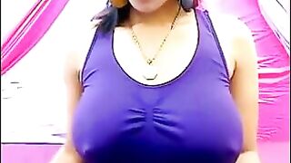 Her nipples are standing through the T-shirt. She's very excited about something