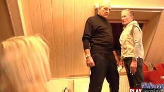 A bearded man with gray hair fucks a young blonde