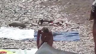 Nudist couple enjoys romantic sex on a beautiful beach. A lot of passion!