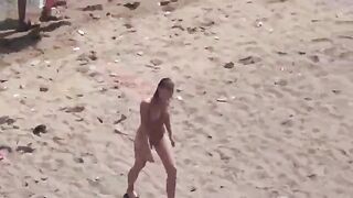 A pair of naked people enjoy themselves in the middle of the sea