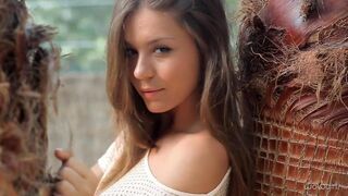 A beautiful Russian girl named Anastasia is stripping slowly