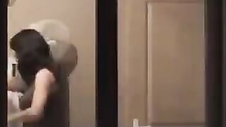 A guy admires himself in the mirror, completely naked and huge cock