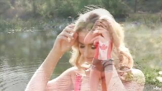 A sexy blonde has a tender masturbation session on the lake shore
