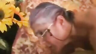 An adult man fucked a gray-haired old woman in black stockings