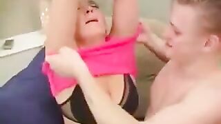 The girl is having sex with her mom in a chair