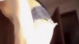 A hot Russian with natural boobs gets undressed and caresses her pussy