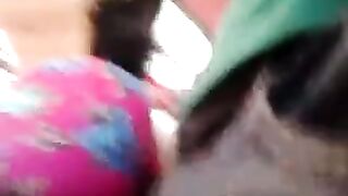 A guy checks the strength of a riser on girls in a bus