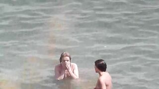 Bunch of beautiful naked girls bathing in the sea