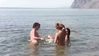 Nudists enjoy a day of fun and sex on the bare beach