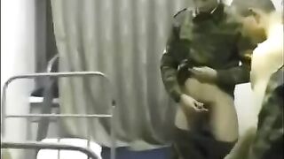 A chick is fucking with soldiers in the crowd in the barracks