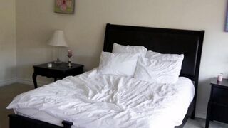 Two pretty blondes are having fun in the bedroom, showcasing their delicate intimacy