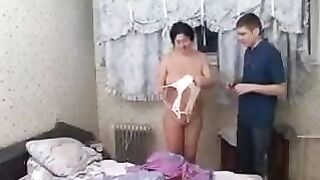 The sexy woman fucks her young son, exploring her body with him
