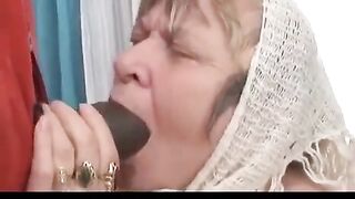 The old lady fucks with a negro boy with big cock
