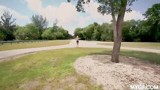 Cute woman is having fun with her boyfriend in the park outdoors