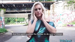 A blonde MILF is getting fucked right on the public street