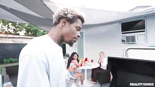 A black guy is fucking a girl at the barbecue in the spring
