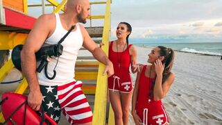 Two hot girls are having fun with a handsome lifeguard in an FFM threesome