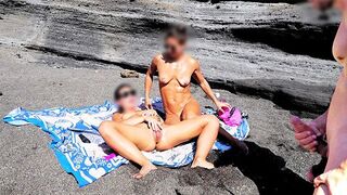 A girl would strip on the beach and stimulate herself while her friend jerks off