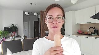 A girl has discharge and plays with it on the sheet, embodying femdom joi