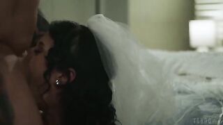 A brunette with a tattoo gets licked on the bed