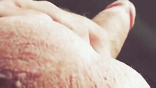 The hand moves up and down the barrel, moaning loudly with dirty talk