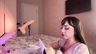 The girl with a sexy black wig has an experiment with a dildo, achieving multiple orgasms