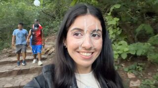 A man made a cumshot on the face of a girl in the park