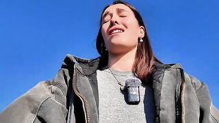 The girl relaxes with solo sex on the public beach, taking a risk