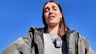 The girl relaxes with solo sex on the public beach, taking a risk